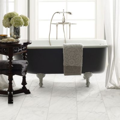 marble tile floors in a bright elegant bathroom